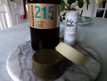 Horizontal image of all three products: natural shampoo and conditioner bar, natural deodorant for sensitive skin, and sweet almond oil. My top 3 non-toxic personal care products of 2020 by a Hopeful Home.