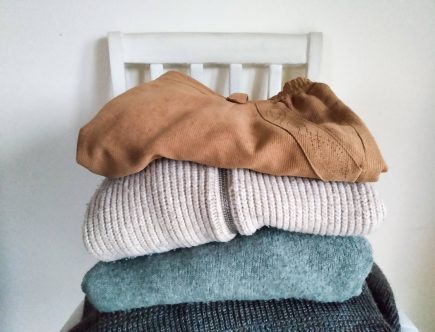 Pile of clothes. 5 Benefits of Buying Second Hand Clothes by a Hopeful Home.