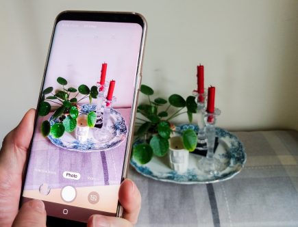 Mobile phone taking a picture. Improve your Mobile Phone Photography Skills by a Hopeful Home.