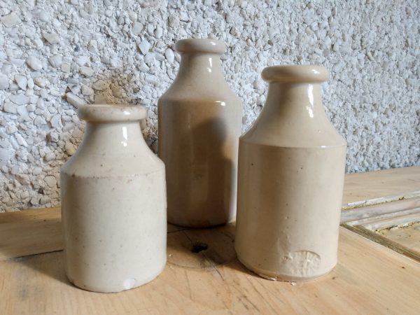 Trio of vintage stoneware ink bottles.