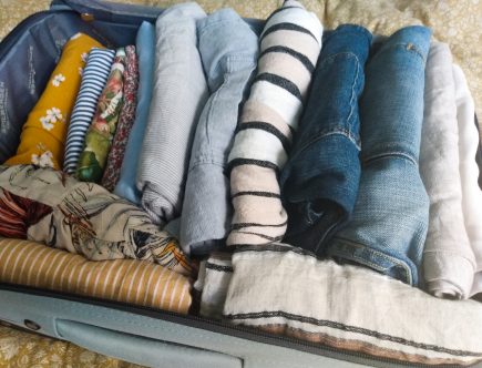 Header image of suitcase with summer wardrobe. As the Seasons Change By A Hopeful Home.